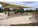 A community outdoor gym features multiple exercise stations under a shaded canopy in a well-maintained area at 8166 Sw 80Th Ter, Ocala, FL 34476