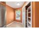 Walk-in pantry includes built-in shelving, window, and lots of storage at 8166 Sw 80Th Ter, Ocala, FL 34476