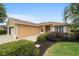 Charming single-story home with brick driveway and lush landscaping on a sunny day at 8166 Sw 80Th Ter, Ocala, FL 34476