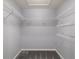 Empty walk-in closet featuring white wire shelving and gray carpet at 8166 Sw 80Th Ter, Ocala, FL 34476