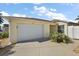 Charming single-story home with a two-car garage and well-maintained landscaping at 1787 Foliage Ln, The Villages, FL 32162
