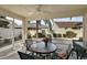 Relaxing screened-in patio with ceiling fan and comfortable outdoor seating arrangement at 1787 Foliage Ln, The Villages, FL 32162