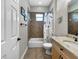 Bathroom with tub-shower combo with tile surround, granite countertop, and tiled floors at 6567 Eagle Ridge Way, Lakeland, FL 33813