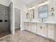Modern bathroom featuring double vanities, vessel sinks, and a walk-in shower at 6567 Eagle Ridge Way, Lakeland, FL 33813