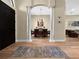 Dining room featuring wood floors, decorative rug, chandelier, and view into an adjacent sitting room at 6567 Eagle Ridge Way, Lakeland, FL 33813
