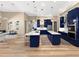 Spacious kitchen with navy cabinets, stainless steel appliances, and a breakfast nook at 6567 Eagle Ridge Way, Lakeland, FL 33813