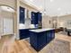 Kitchen featuring a center island, stainless steel appliances, and hardwood floors at 6567 Eagle Ridge Way, Lakeland, FL 33813