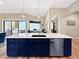 Large kitchen island featuring bar seating, stainless steel dishwasher and white countertops at 6567 Eagle Ridge Way, Lakeland, FL 33813