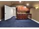 Wet bar area with modern cabinets, a sink, and a mini-refrigerator at 6567 Eagle Ridge Way, Lakeland, FL 33813