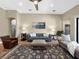 Spacious living room with a blue sofa, area rug, and plenty of seating at 6567 Eagle Ridge Way, Lakeland, FL 33813