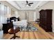 Relaxing main bedroom with a cozy rug, soft lighting, and hardwood floors at 6567 Eagle Ridge Way, Lakeland, FL 33813