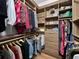 Spacious walk-in closet with custom shelving, hanging rods, and drawers at 6567 Eagle Ridge Way, Lakeland, FL 33813