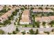 Aerial view of homes showcasing the community layout, well-maintained streets, and proximity to nearby amenities at 1450 Rolling Fairway Dr, Davenport, FL 33896