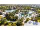 Resort-style pool area with lazy river, beach volleyball, lush landscaping, and clubhouse in a beautiful community at 1450 Rolling Fairway Dr, Davenport, FL 33896