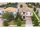 Stunning aerial view of a neighborhood with tile roofs and screen enclosed pools at 1450 Rolling Fairway Dr, Davenport, FL 33896