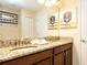 Bathroom with double sinks and granite countertops providing ample space and style at 1450 Rolling Fairway Dr, Davenport, FL 33896