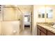 Bathroom featuring a walk-in shower and granite countertops, providing a luxurious and modern feel at 1450 Rolling Fairway Dr, Davenport, FL 33896