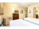 Nautical-themed bedroom featuring twin beds, a dresser, and tasteful wall decor, creating a relaxing atmosphere at 1450 Rolling Fairway Dr, Davenport, FL 33896