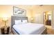 Bright bedroom with en-suite bath and large windows for natural light at 1450 Rolling Fairway Dr, Davenport, FL 33896