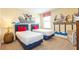 Bedroom with two twin beds and decorative cartoon wall art at 1450 Rolling Fairway Dr, Davenport, FL 33896