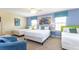 Inviting bedroom with twin beds, colorful decor, and ample natural light at 1450 Rolling Fairway Dr, Davenport, FL 33896
