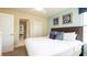 Comfortable bedroom with a plush bed, stylish decor, and ample natural light at 1450 Rolling Fairway Dr, Davenport, FL 33896