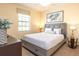 Bedroom featuring a comfortable bed, soft lighting, and stylish decor at 1450 Rolling Fairway Dr, Davenport, FL 33896