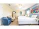 Charming bedroom offers two beds, a cozy armchair, and a bright, fun decor at 1450 Rolling Fairway Dr, Davenport, FL 33896