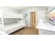 View of bedroom with bunk beds and dresser at 1450 Rolling Fairway Dr, Davenport, FL 33896