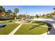 Picturesque fountain surrounded by lush greenery, adding a touch of elegance to the outdoor space at 1450 Rolling Fairway Dr, Davenport, FL 33896