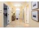 Welcoming foyer with neutral tile flooring, decorative lighting and wall art at 1450 Rolling Fairway Dr, Davenport, FL 33896