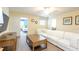 Bright living room features a plush white sofa and cozy seating area at 1450 Rolling Fairway Dr, Davenport, FL 33896