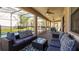 Covered patio area featuring comfortable seating and outdoor dining at 1450 Rolling Fairway Dr, Davenport, FL 33896