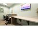 Dedicated workspace with modern desks and comfortable seating, ideal for remote work or study at 1450 Rolling Fairway Dr, Davenport, FL 33896