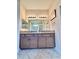 Bathroom featuring a double vanity sink with granite countertop, tiled floor and modern fixtures at 1568 Cordgrass Way, Lakeland, FL 33813
