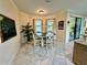 Bright dining area featuring a table with seating for four and a chalkboard accent wall at 1568 Cordgrass Way, Lakeland, FL 33813