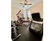 Home gym with weights, treadmill, and a workout bench at 1568 Cordgrass Way, Lakeland, FL 33813