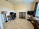 Versatile office space features a desk, shelving, and a large window at 1568 Cordgrass Way, Lakeland, FL 33813