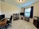 Versatile office space features a desk, shelving, and a large window at 1568 Cordgrass Way, Lakeland, FL 33813