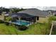 A beautiful screened in pool with lush landscaping is perfect for enjoying the outdoors at 1568 Cordgrass Way, Lakeland, FL 33813