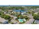 Aerial view of community with pool and lakeside living featuring mature trees and lush landscaping at 200 Maitland Ave # 114, Altamonte Springs, FL 32701