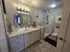 Elegant bathroom featuring a marble-tiled shower and modern vanity with a large mirror at 200 Maitland Ave # 114, Altamonte Springs, FL 32701