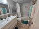 Well-lit bathroom featuring a modern vanity, toilet and shower at 200 Maitland Ave # 114, Altamonte Springs, FL 32701
