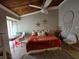 Cozy bedroom featuring a large bed, desk area, and unique decor at 200 Maitland Ave # 114, Altamonte Springs, FL 32701