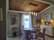 Dining room with elegant lighting, wood ceiling and views of the water at 200 Maitland Ave # 114, Altamonte Springs, FL 32701
