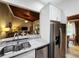 Kitchen featuring stainless appliances and marble counter top, with a wood ceiling at 200 Maitland Ave # 114, Altamonte Springs, FL 32701
