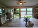 Bright home office with large windows offering stunning water views and light wood flooring at 200 Maitland Ave # 114, Altamonte Springs, FL 32701