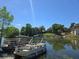 Waterfront view featuring several boats and lush landscaping at 200 Maitland Ave # 114, Altamonte Springs, FL 32701