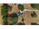 Aerial view of the landscaped property with a long driveway and well-maintained lawn at 2899 Sw 66 St, Ocala, FL 34476