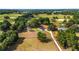 Aerial view of a property with landscaped greenery and a long driveway at 2899 Sw 66 St, Ocala, FL 34476